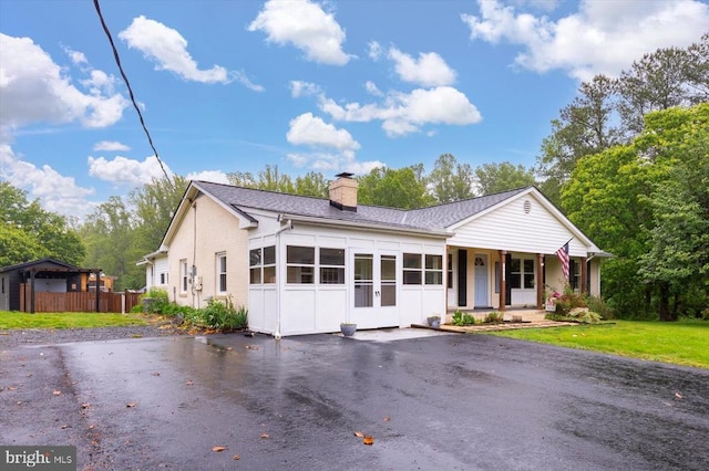 7615 Morris Rd, Spotsylvania, VA 22551 - ranch-style house featuring a chimney, driveway, a porch, and a shingled roof