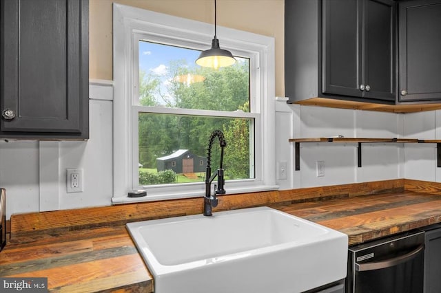 7615 Morris Rd, Spotsylvania, VA 22551 - kitchen with a sink, butcher block countertops, stainless steel dishwasher, and open shelves