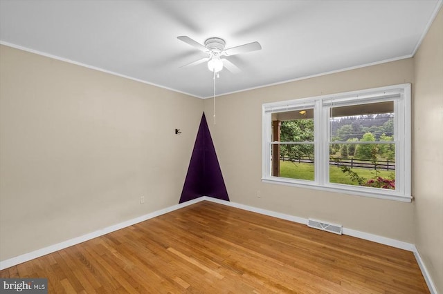 7615 Morris Rd, Spotsylvania, VA 22551 - unfurnished room featuring baseboards, ornamental molding, wood finished floors, and a ceiling fan