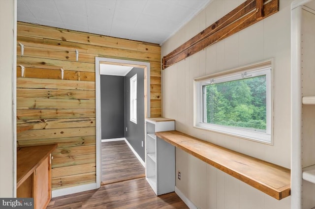 7615 Morris Rd, Spotsylvania, VA 22551 - doorway featuring wood walls, dark wood-style floors, and baseboards