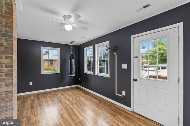 7615 Morris Rd, Spotsylvania, VA 22551 - foyer with wood finished floors, plenty of natural light, baseboards, ceiling fan, and crown molding