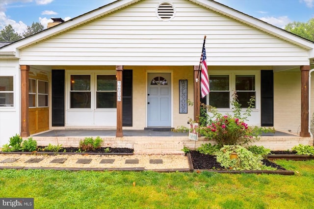 7615 Morris Rd, Spotsylvania, VA 22551 - bungalow featuring a porch, a chimney, and a front lawn