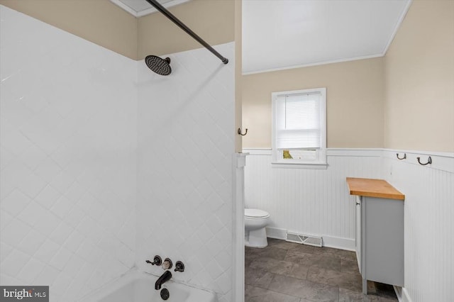 7615 Morris Rd, Spotsylvania, VA 22551 - full bathroom featuring washtub / shower combination, toilet, a wainscoted wall, and ornamental molding