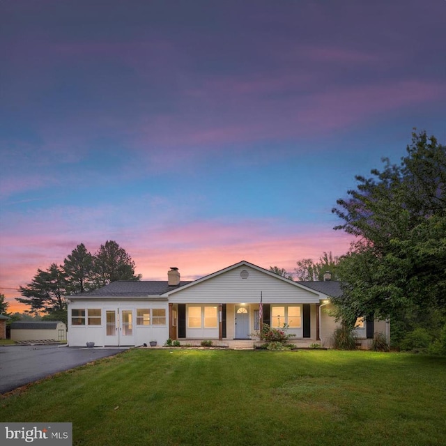 7615 Morris Rd, Spotsylvania, VA 22551 - ranch-style home with a lawn, a chimney, and asphalt driveway