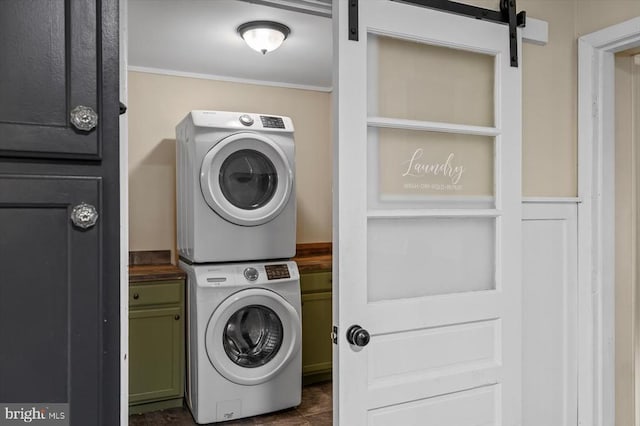 7615 Morris Rd, Spotsylvania, VA 22551 - laundry area with stacked washer / drying machine, ornamental molding, and cabinet space