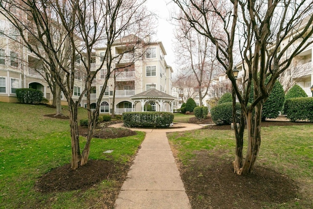 view of home's community with a gazebo and a lawn