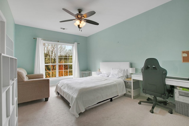 bedroom featuring carpet flooring, a ceiling fan, and visible vents