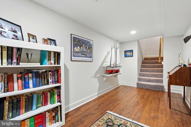 playroom with wood finished floors, baseboards, and recessed lighting
