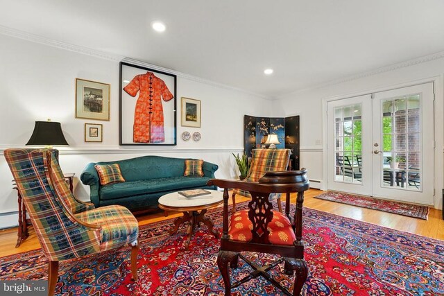 living area featuring french doors, wood finished floors, crown molding, and recessed lighting