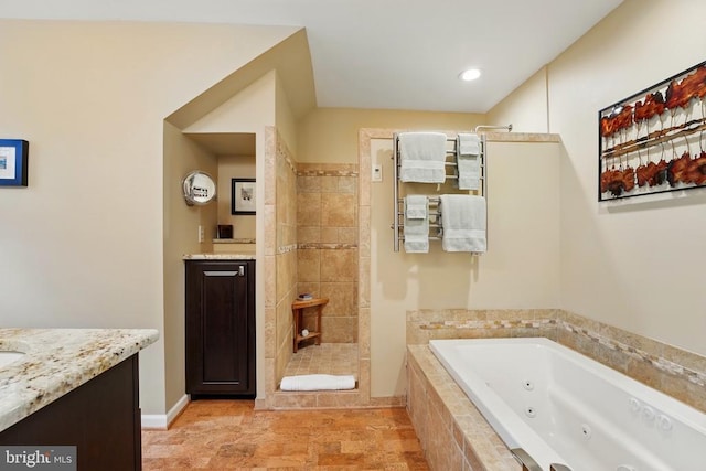 full bath featuring vanity, a walk in shower, a whirlpool tub, and recessed lighting
