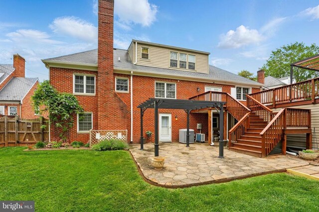 back of property featuring a pergola, brick siding, a patio area, and a wooden deck