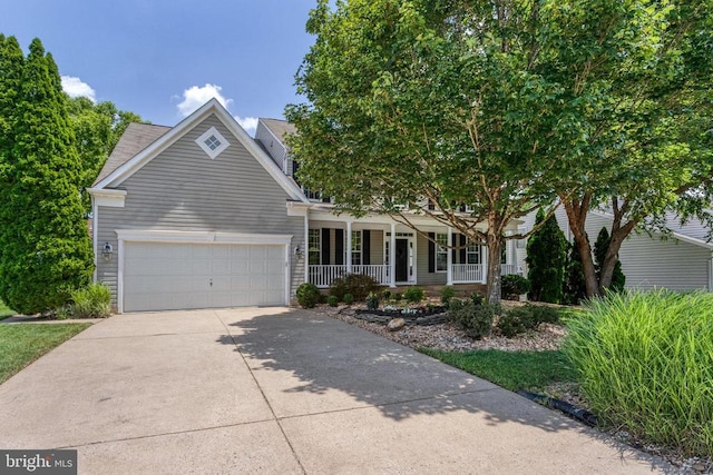 11211 Spring Meadow Blvd, Fredericksburg, VA 22407 - view of front of house featuring covered porch, a garage, and driveway