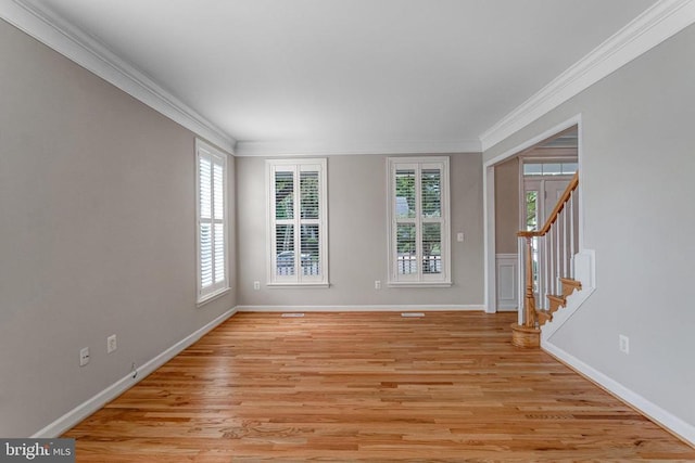 11211 Spring Meadow Blvd, Fredericksburg, VA 22407 - unfurnished room with ornamental molding, plenty of natural light, stairs, and light wood finished floors