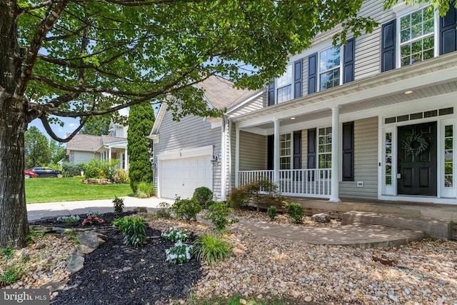 11211 Spring Meadow Blvd, Fredericksburg, VA 22407 - traditional-style house featuring a porch, an attached garage, and driveway