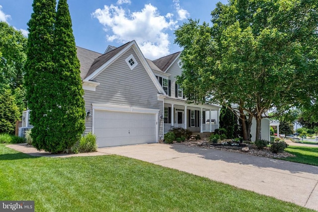 11211 Spring Meadow Blvd, Fredericksburg, VA 22407 - traditional home featuring a porch, driveway, a front yard, and a garage