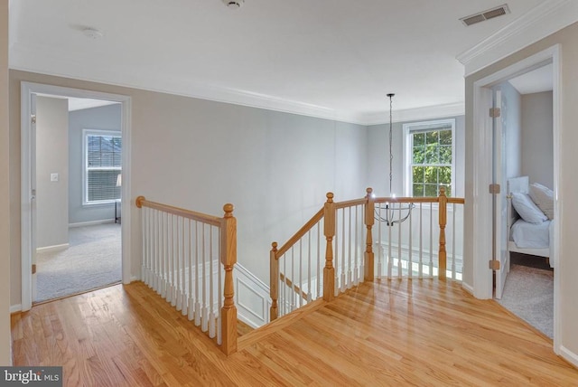 11211 Spring Meadow Blvd, Fredericksburg, VA 22407 - corridor featuring an upstairs landing, wood finished floors, and ornamental molding