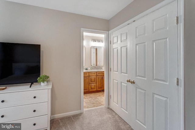 11211 Spring Meadow Blvd, Fredericksburg, VA 22407 - bedroom with light carpet, connected bathroom, and a closet