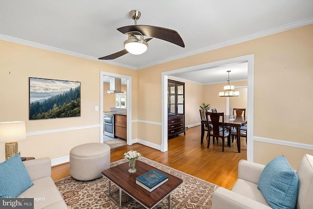 148 Red Hill Rd, Orange, VA 22960 - living area featuring wood finished floors, crown molding, a ceiling fan, baseboards, and a chandelier