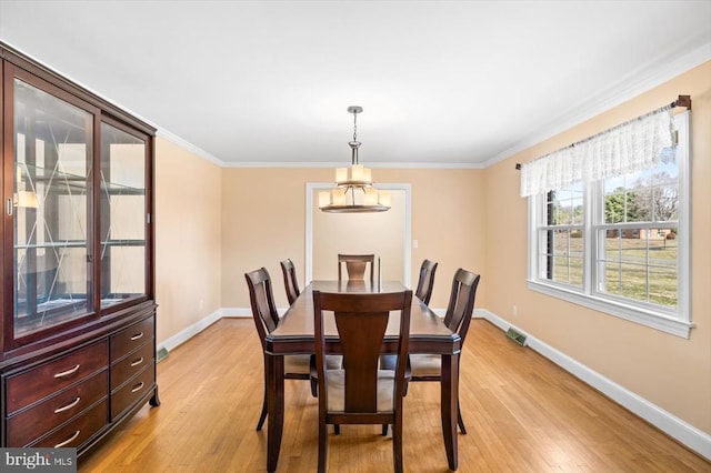 148 Red Hill Rd, Orange, VA 22960 - dining area with light wood-type flooring, baseboards, ornamental molding, and a chandelier
