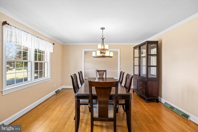 148 Red Hill Rd, Orange, VA 22960 - dining space featuring a chandelier, light wood finished floors, crown molding, and baseboards