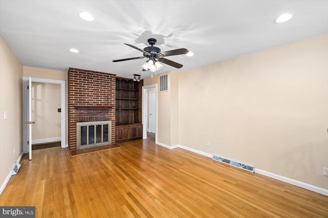 148 Red Hill Rd, Orange, VA 22960 - unfurnished living room with baseboards, wood finished floors, a fireplace, recessed lighting, and a ceiling fan