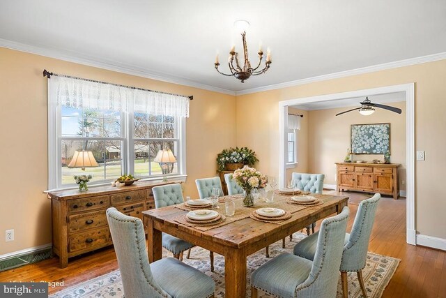 148 Red Hill Rd, Orange, VA 22960 - dining area featuring crown molding, a chandelier, healthy amount of natural light, and wood finished floors
