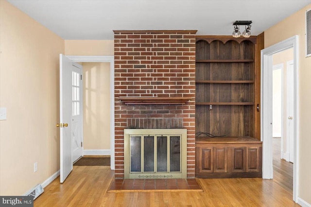 148 Red Hill Rd, Orange, VA 22960 - unfurnished living room featuring wood finished floors, a fireplace, and baseboards