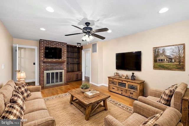 148 Red Hill Rd, Orange, VA 22960 - living room featuring recessed lighting, a brick fireplace, wood finished floors, ceiling fan, and baseboards