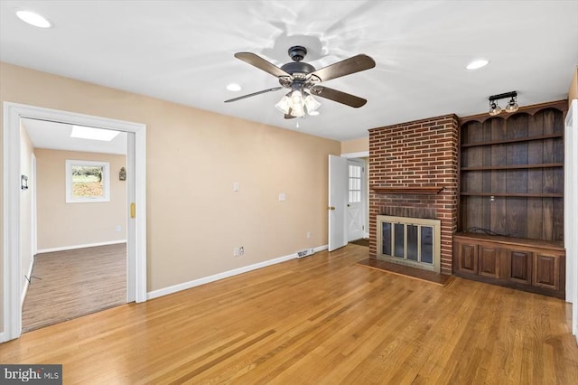 148 Red Hill Rd, Orange, VA 22960 - unfurnished living room with light wood-style floors, baseboards, a fireplace, ceiling fan, and recessed lighting