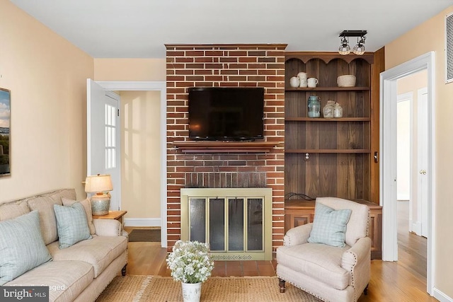 148 Red Hill Rd, Orange, VA 22960 - living room featuring a fireplace and wood finished floors