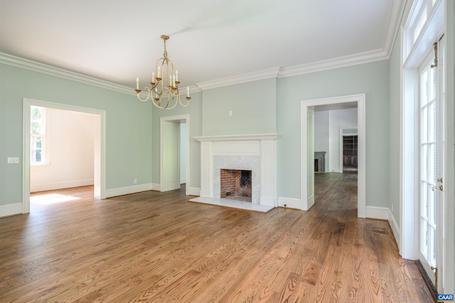 2621 Coopers Ln, Charlottesville, VA 22902 - unfurnished living room featuring wood finished floors, a fireplace, a chandelier, crown molding, and baseboards