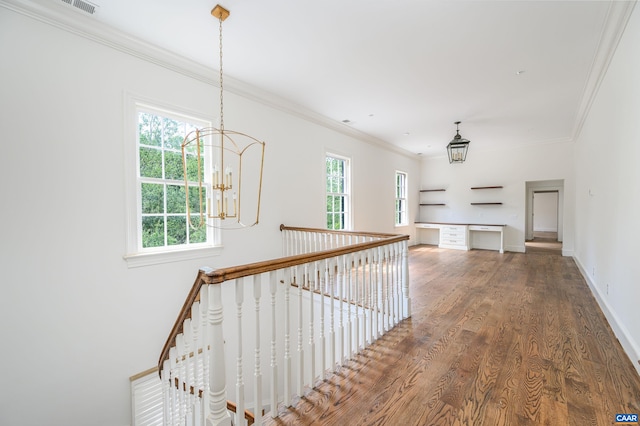 2621 Coopers Ln, Charlottesville, VA 22902 - hall featuring a notable chandelier, baseboards, crown molding, wood finished floors, and an upstairs landing