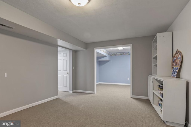 8802 Dundee Dr, Fredericksburg, VA 22408 - below grade area with light carpet and baseboards