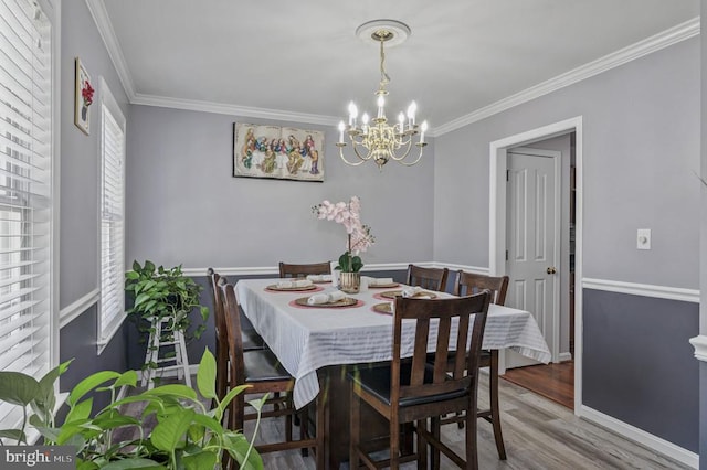 8802 Dundee Dr, Fredericksburg, VA 22408 - dining room featuring a chandelier, ornamental molding, wood finished floors, and baseboards
