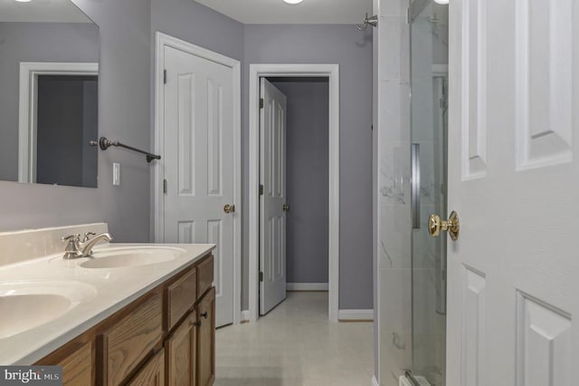 8802 Dundee Dr, Fredericksburg, VA 22408 - full bathroom with a shower, double vanity, and baseboards