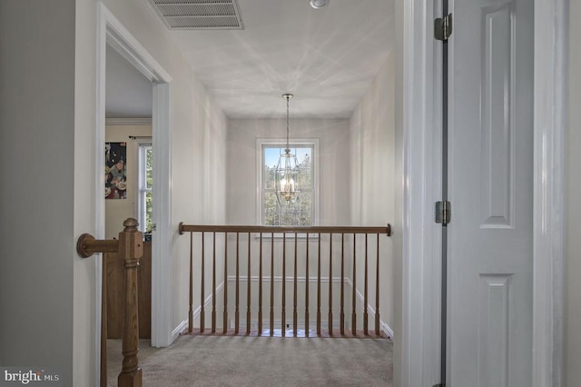 8802 Dundee Dr, Fredericksburg, VA 22408 - hallway with an upstairs landing, carpet flooring, a chandelier, and baseboards
