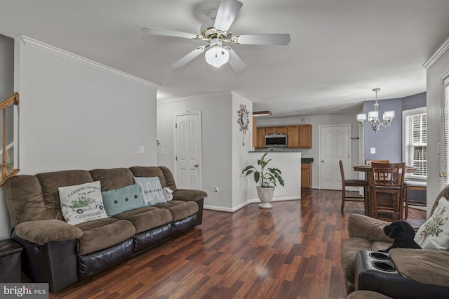 8802 Dundee Dr, Fredericksburg, VA 22408 - living room featuring a chandelier, dark wood-type flooring, crown molding, a ceiling fan, and baseboards