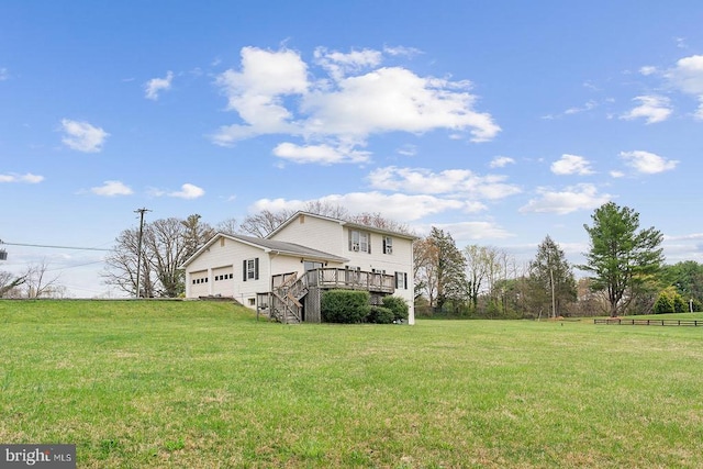 14026 Eggbornsville Rd, Culpeper, VA 22701 - rear view of property featuring a deck, an attached garage, and a lawn