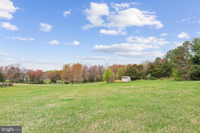 14026 Eggbornsville Rd, Culpeper, VA 22701 - view of yard with a rural view, an outdoor structure, a view of trees, and a storage unit