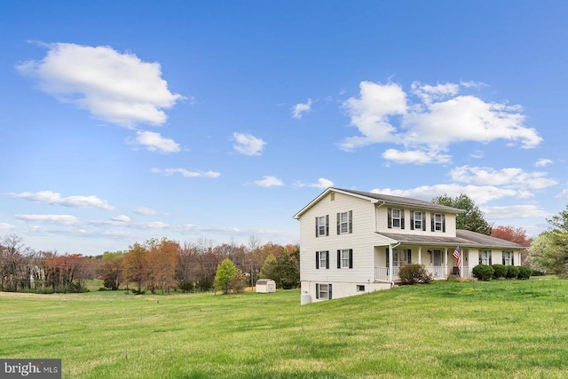 14026 Eggbornsville Rd, Culpeper, VA 22701 - view of front facade featuring covered porch, an outbuilding, a front lawn, and a storage unit