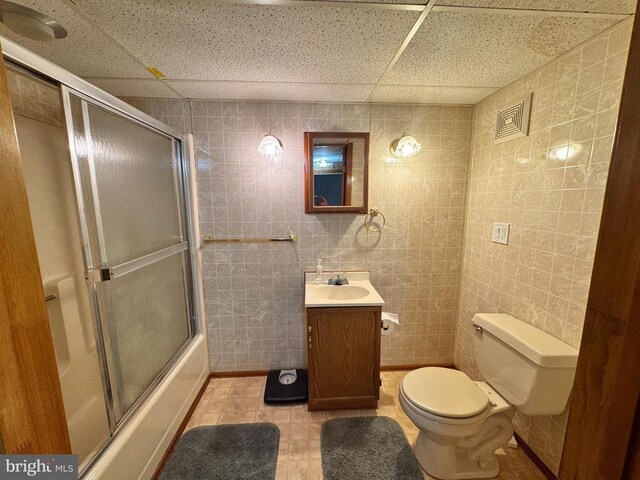 436 Castleton View Rd, Castleton, VA 22716 - full bath with vanity, bath / shower combo with glass door, a paneled ceiling, tile walls, and tile patterned flooring
