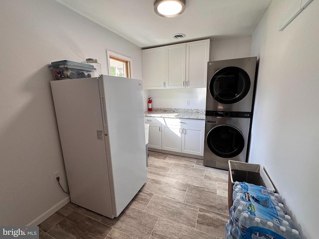 436 Castleton View Rd, Castleton, VA 22716 - laundry room with stacked washer / drying machine and cabinet space