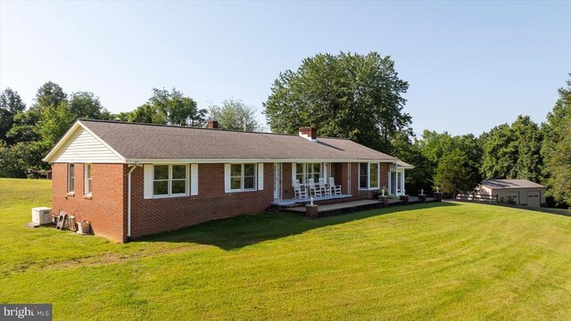 436 Castleton View Rd, Castleton, VA 22716 - view of front of house featuring covered porch, brick siding, a front yard, and a chimney