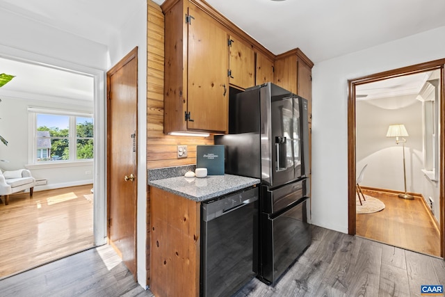1211 River Vista Ave, Charlottesville, VA 22901 - kitchen with stainless steel fridge with ice dispenser, wood finished floors, dishwashing machine, and brown cabinets