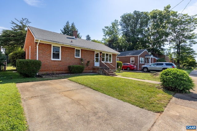 1211 River Vista Ave, Charlottesville, VA 22901 - view of front of home with brick siding, a chimney, and a front lawn