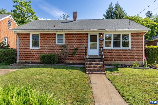 1211 River Vista Ave, Charlottesville, VA 22901 - bungalow-style home with entry steps, a chimney, a front lawn, brick siding, and roof with shingles
