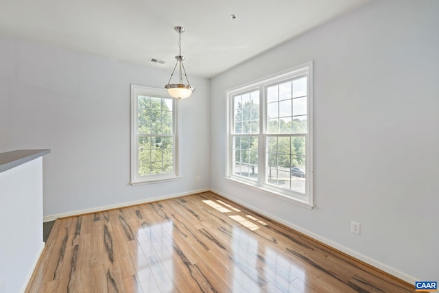 260 Riverbend Dr Unit 3C, Charlottesville, VA 22911 - unfurnished dining area with wood-type flooring