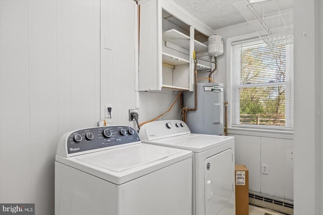 laundry room with electric water heater, washing machine and dryer, a baseboard radiator, and a textured ceiling
