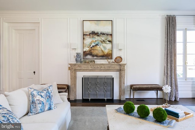  - living room with a fireplace, wood finished floors, and healthy amount of natural light