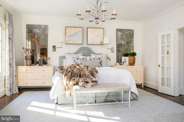  - bedroom with ornamental molding, a chandelier, wood finished floors, and baseboards